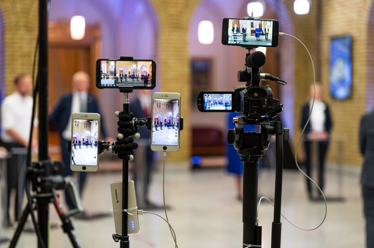 Crafting Captivating Headlines: Your awesome post title goes here Multi-camera setup capturing a live event indoors, showcasing modern filming technology.